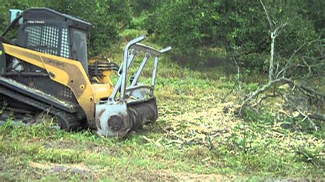 clearing trees with skid steer|skid steer clearance.